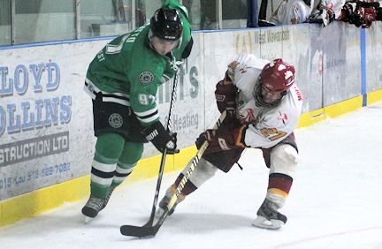 Brett Catto (L) of the Wolves and Ean Moffat of the Lancers struggle for possession of the puck